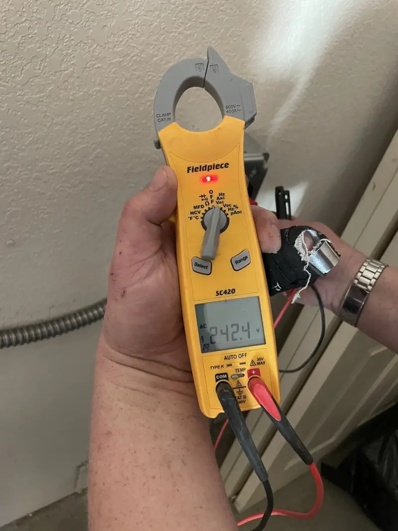 Voltage testing with clamp meter during Ceiling Fan Installation in Sandia Heights